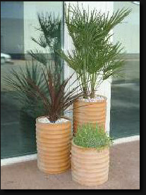 Tall round ribbed planter in terracotta colour Tall round ribbed planter in terracotta colour